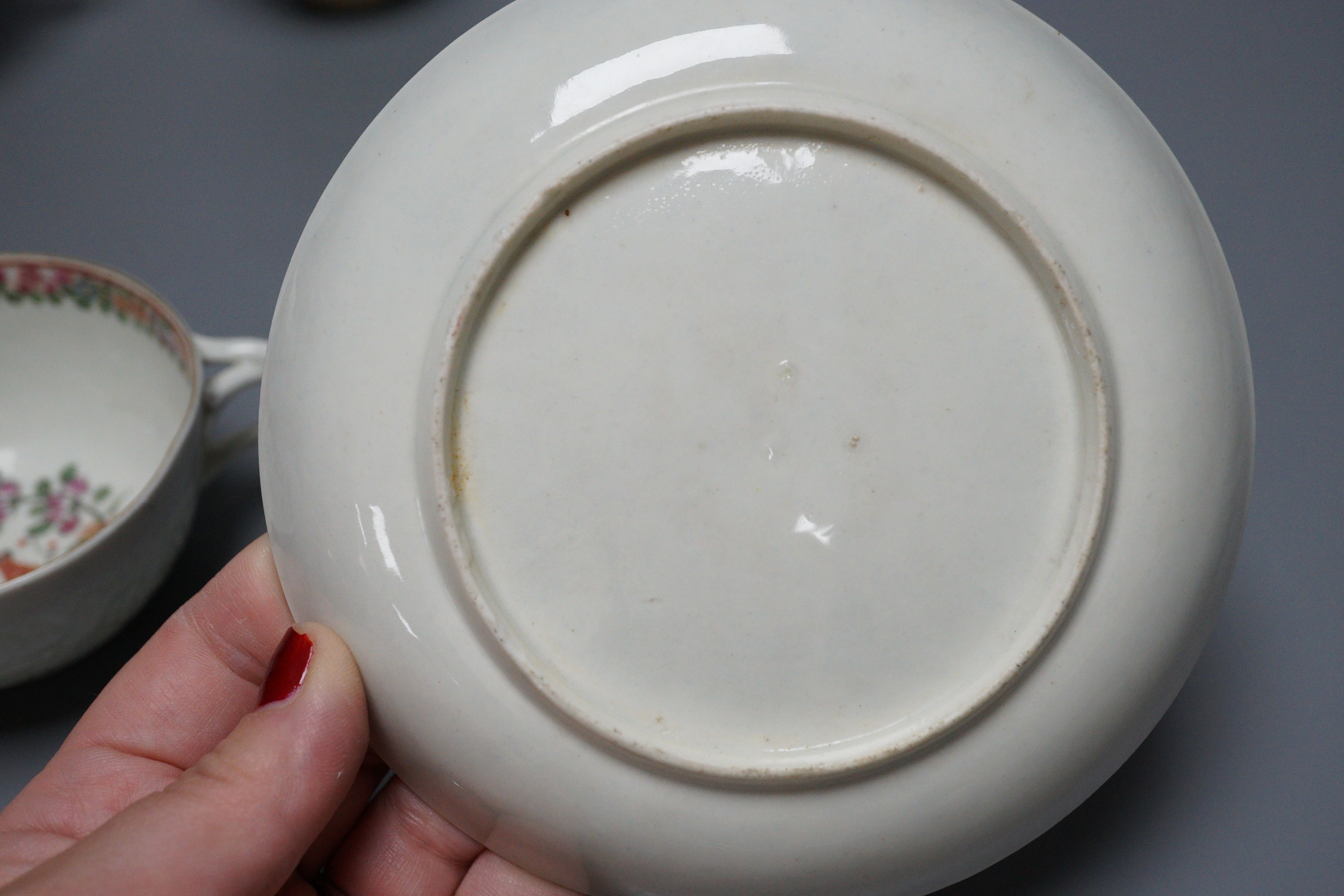 A small bone china pot pourri, possibly Spode, a relief moulded teacup and saucer, and three cups